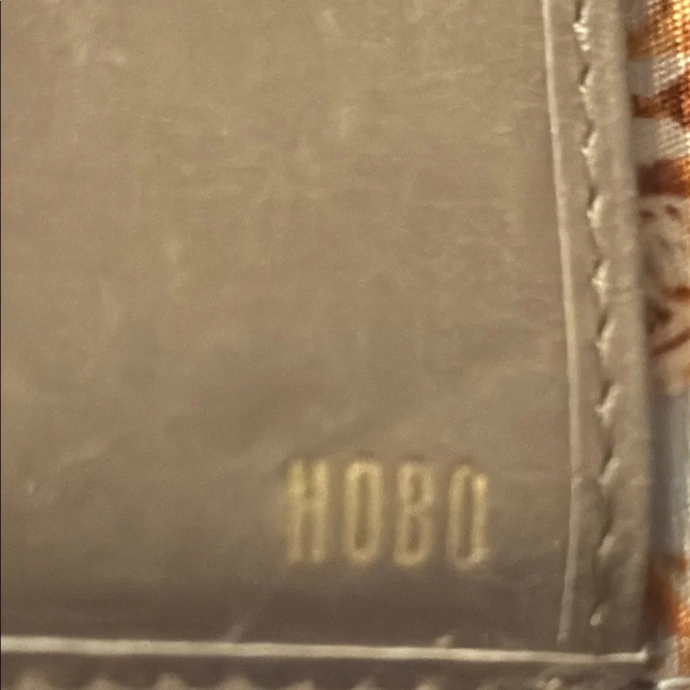 Elegant Robin taupe Wallet by Hobo with gold accents NWT